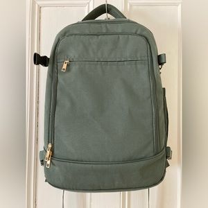 Green laptop travel backpack and packing cubes